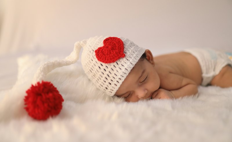 Baby in a white knit cap